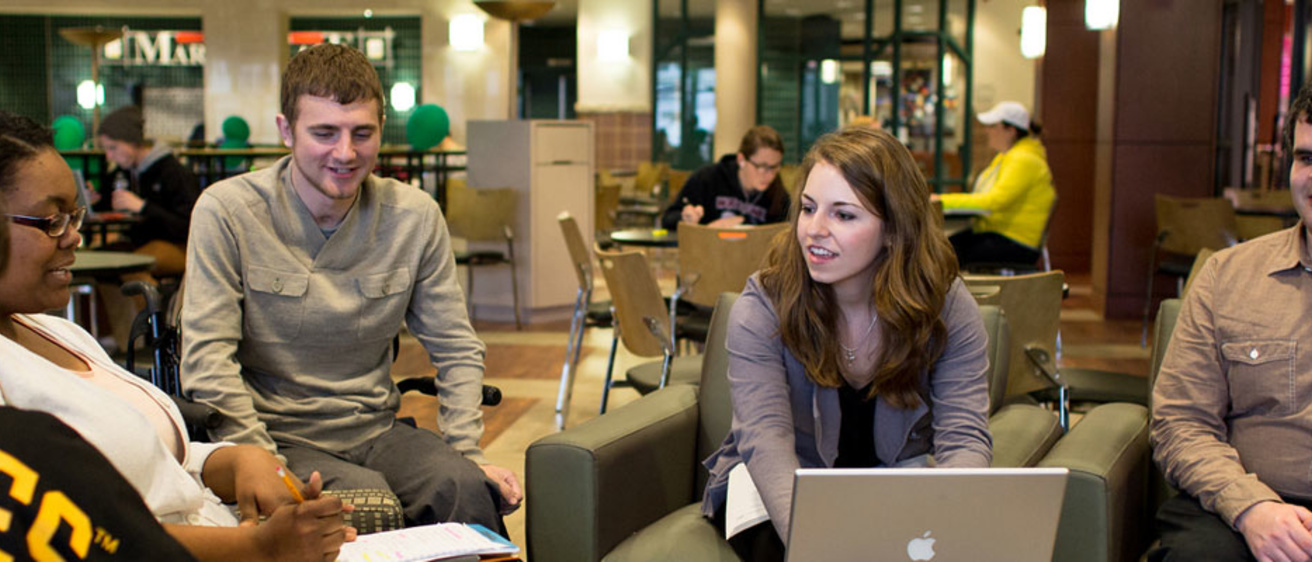 Students sitting in the lobby of Burge Residence Hall
